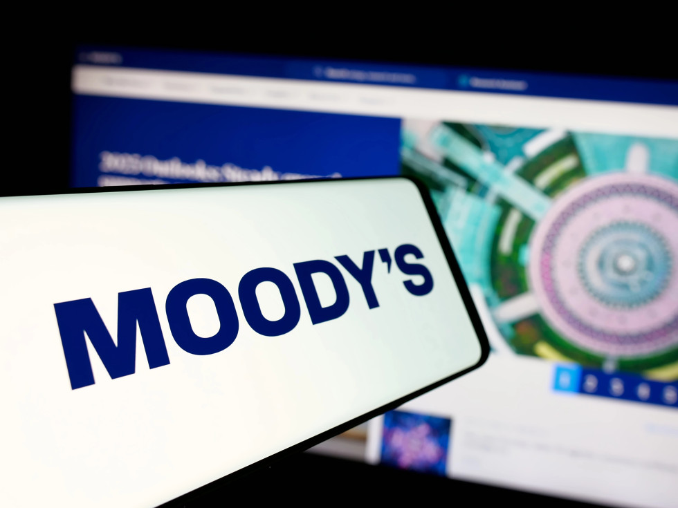 A mobile phone with the name Moody's on its screen